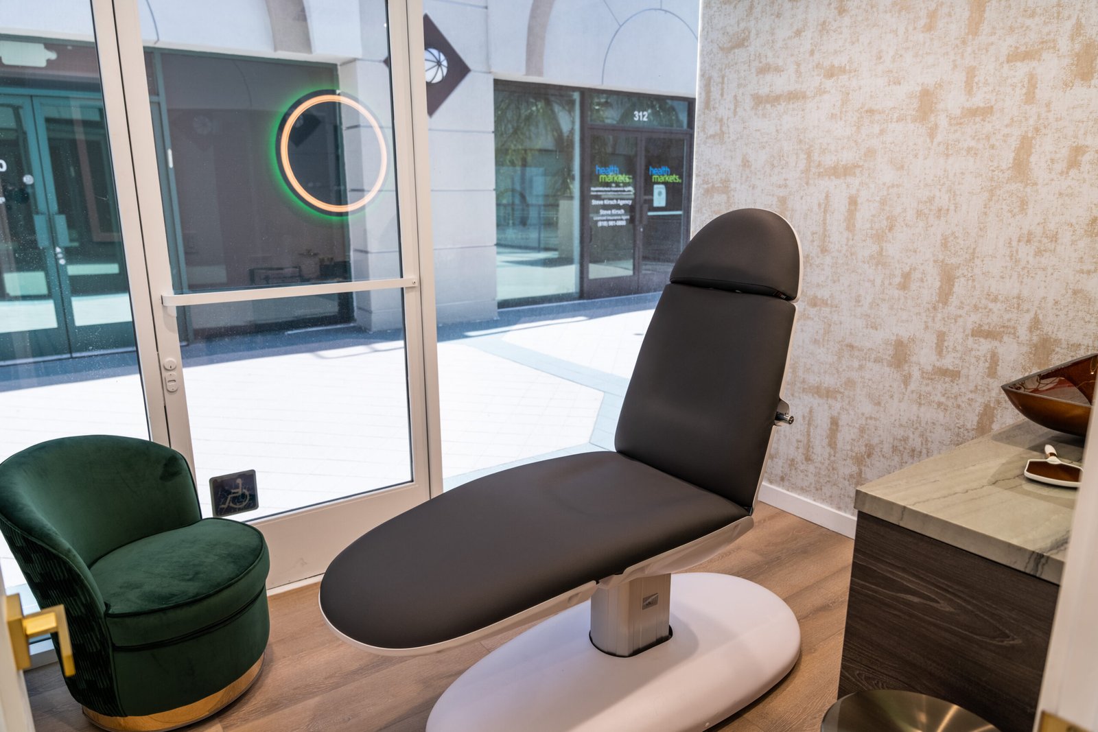 Glow Aesthetic Center treatment room seating by the window